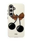 Sweet Sixteen Tough Phone Case with two black cherries and brown bow on silky beige background full covering the device from our collection Mini Cocktail