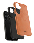 Solid dark orange Tough Phone Case with rustic rusty lines, part of the Pumpkin Pie collection for a rugged and seasonal style.