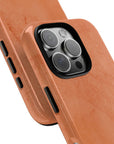 Solid dark orange Tough Phone Case with rustic rusty lines, part of the Pumpkin Pie collection for a rugged and seasonal style.