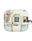 Pick Me Up At 8 Earbuds Case—Glossy polycarbonate shell featuring vintage travel watercolor camper and floral artwork, lightweight design, with clip attachment.