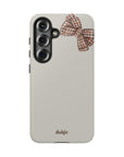 Fall Box Tough Phone Case featuring a plaid bow on a taupe background from fall  Collection Toffee Latte