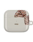 Beige wireless earbuds case with a plaid ribbon 