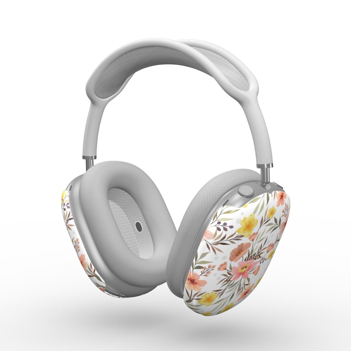 Gray AirPods Max with floral design on a white background