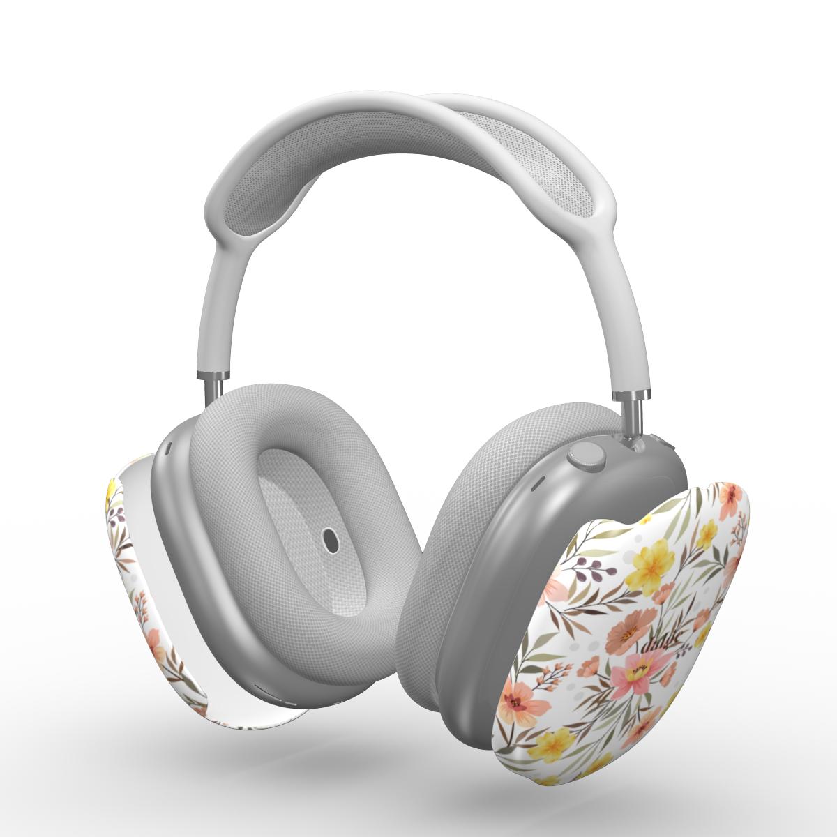Gray AirPods Max with floral design on a white background