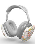 Gray AirPods Max with floral design on a white background