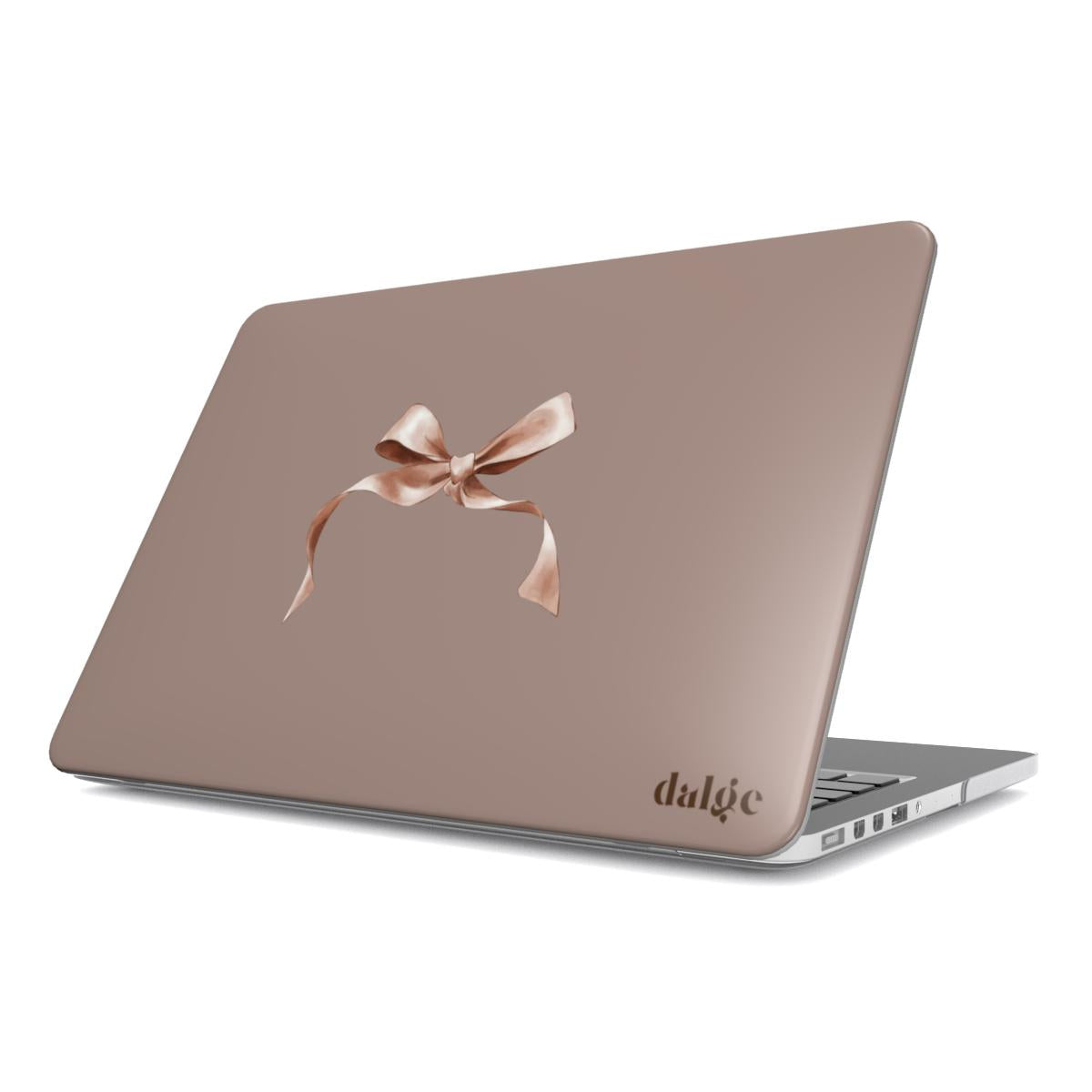 MacBook case from the Toffee Latte Fall Collection showcasing a warm brown background and a delicate salmon pink bow for a chic and sophisticated look.