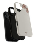 A Phone case with a brown bow showing two layers of case for extra durability