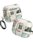 Pick Me Up At 8 Earbuds Case—Glossy polycarbonate shell featuring vintage travel watercolor camper and floral artwork, lightweight design, with clip attachment.