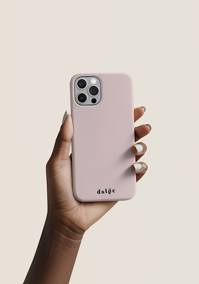A person holding an iPhone with a baby pink phone case, featuring the brand name 'dalge' at the bottom, against a plain light background