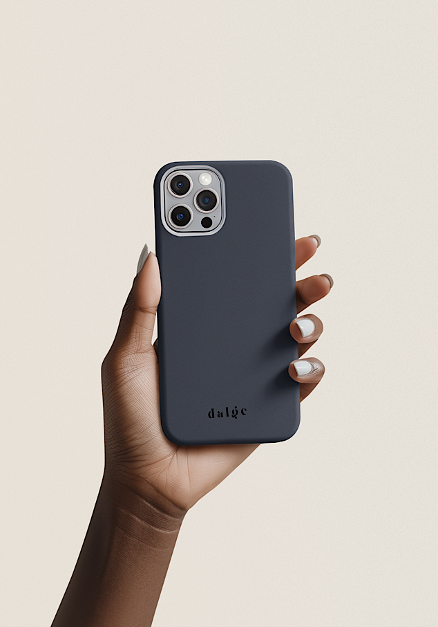 A person holding an iPhone with a plain dark blue phone case featuring the brand name 'dalge' at the bottom, against a light, neutral background