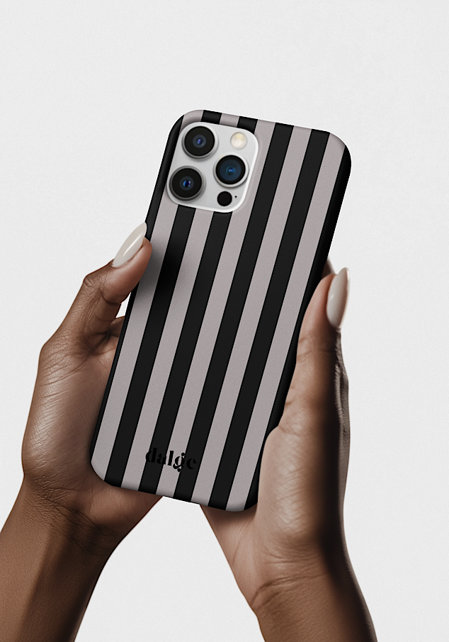 A person holding an iPhone with a black and gray striped phone case, featuring the brand name 'dalge' at the bottom, against a plain light background