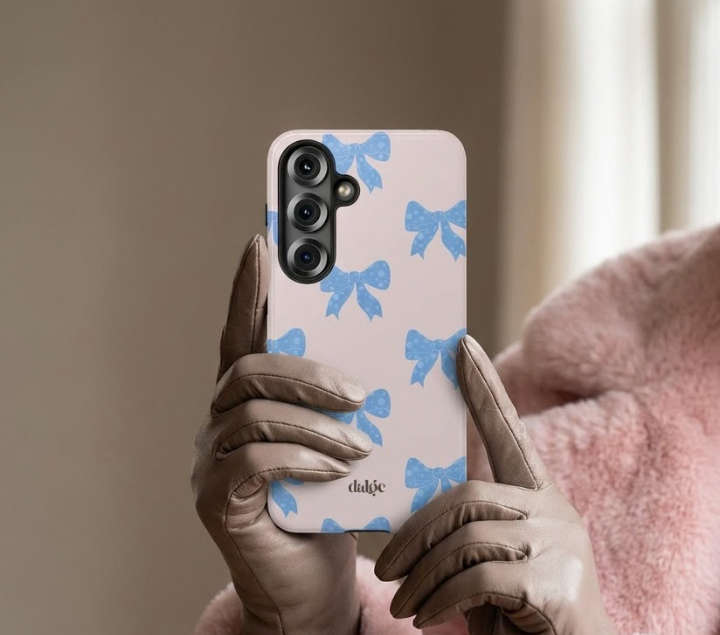 Adage Phone Case | Ballerina-inspired design with blue bows and elegant pastel background for stylish protection.